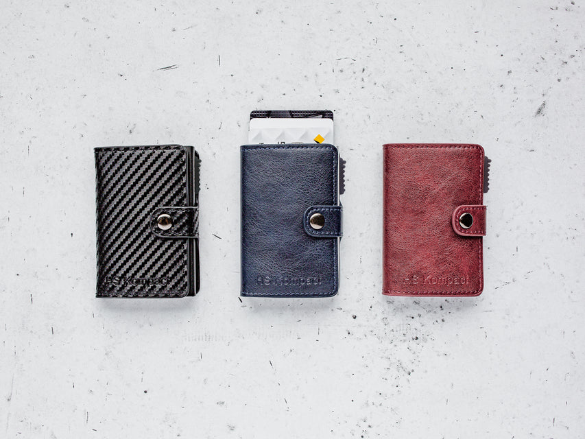 Kompact Classic vegan leather wallet range in Carbon, Cobalt Navy and Scarlet Red (left to right)